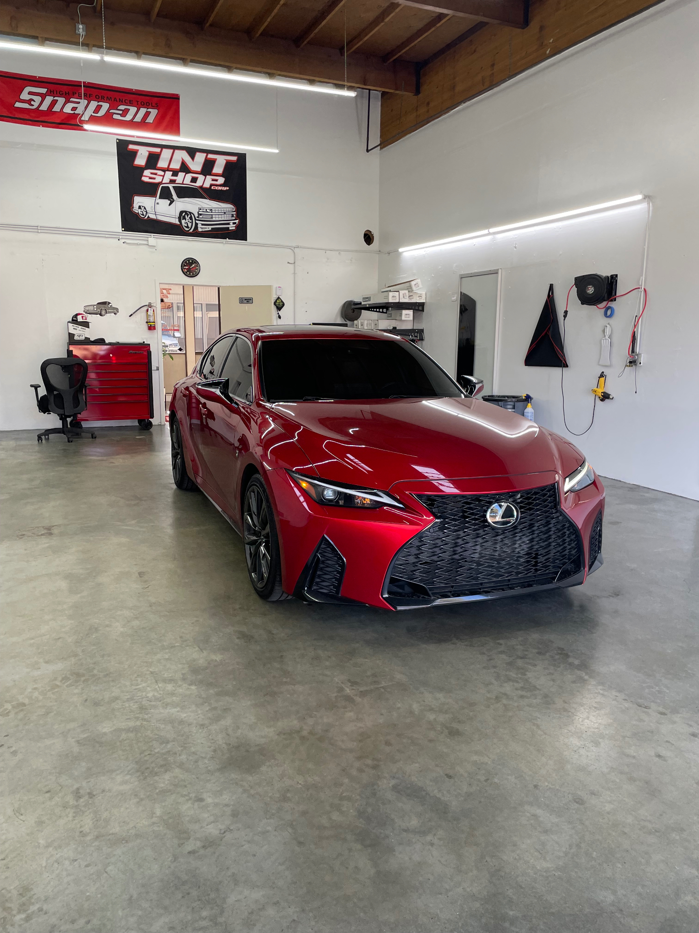 Red Lexus IS F-Sport tinted at Tint Shop Corp.