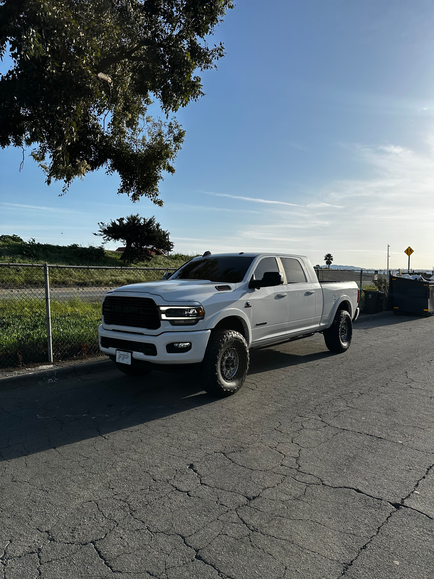 White lifted Ram 2500 with tinted windows